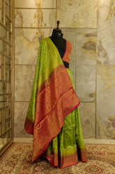 Green soft silk banarasi all over buttas with contrast pink brocade Pallu and pink brocade blouse